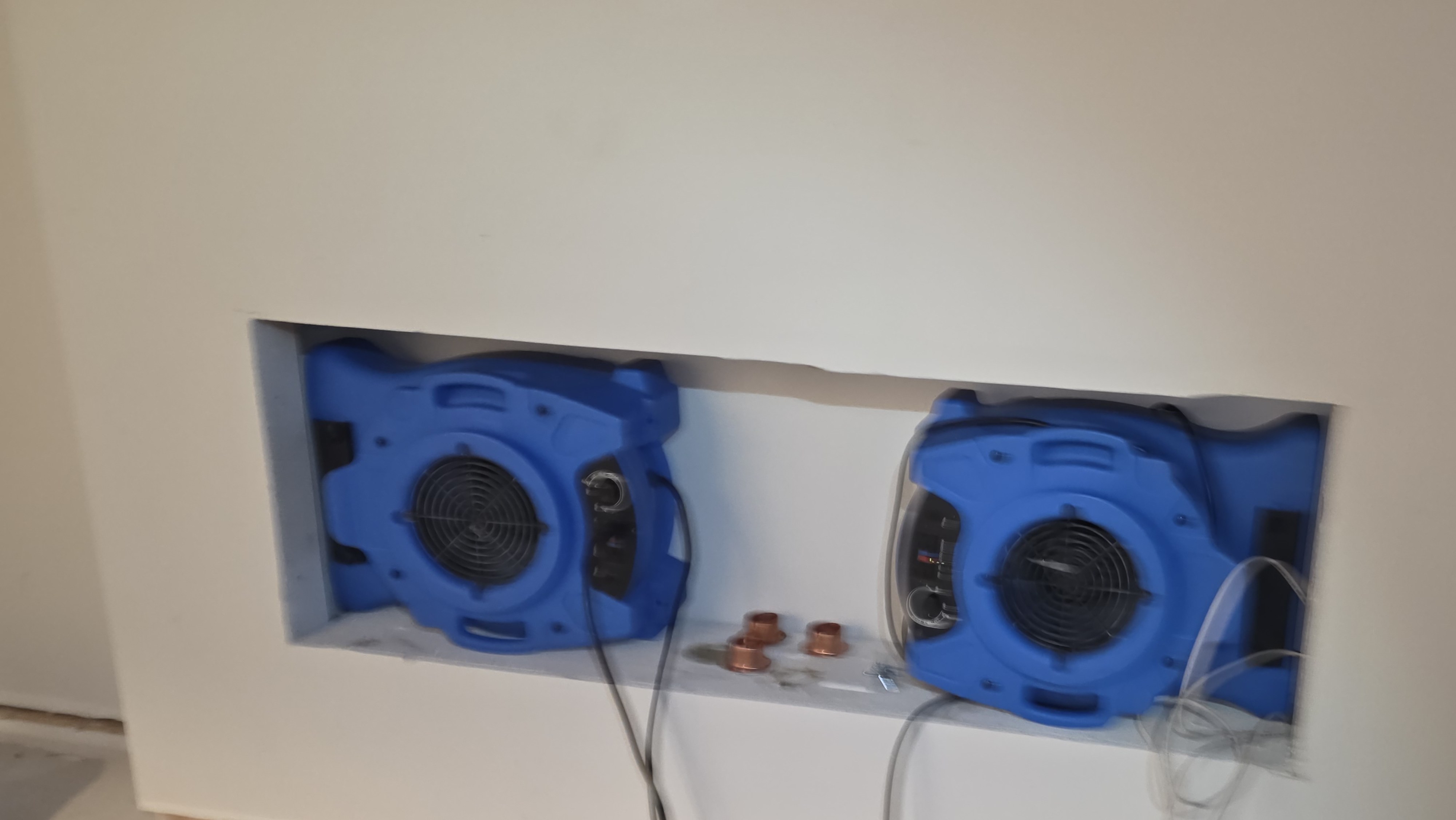 Air movers positioned along an opened lower wall